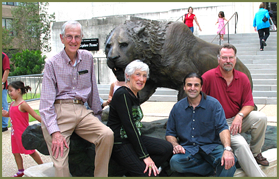 Ernest and Sarah Butler, John Maisano and Ed Theriot with the saber-toothed cat sculpture
